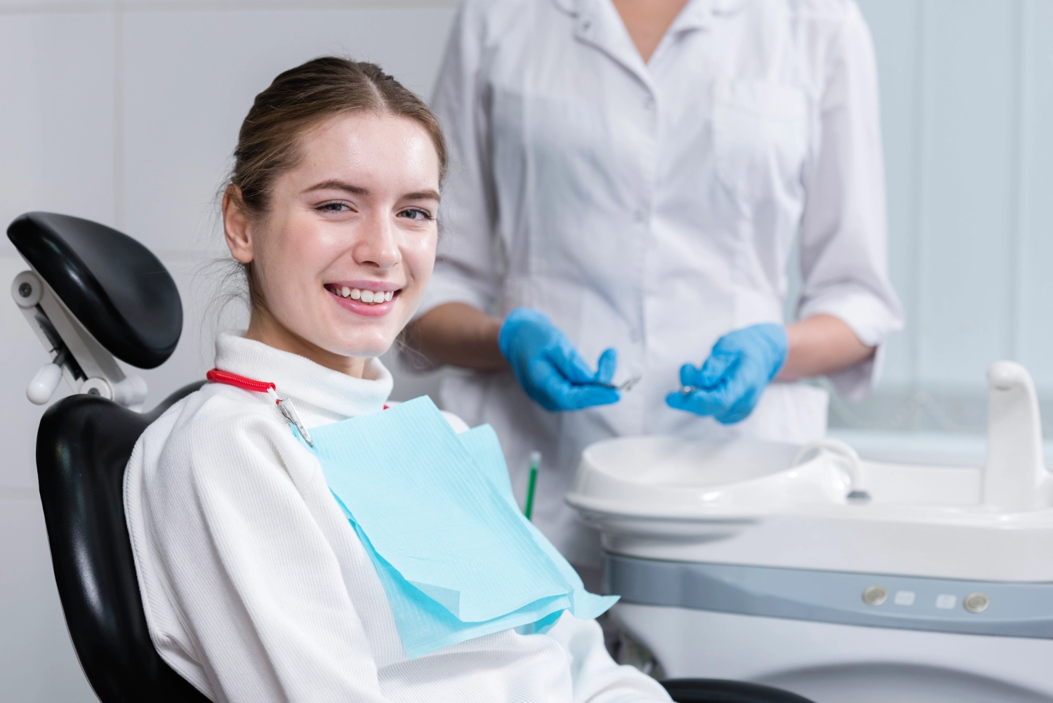 Image of girl smiling with dental team | Plano Smile Studio